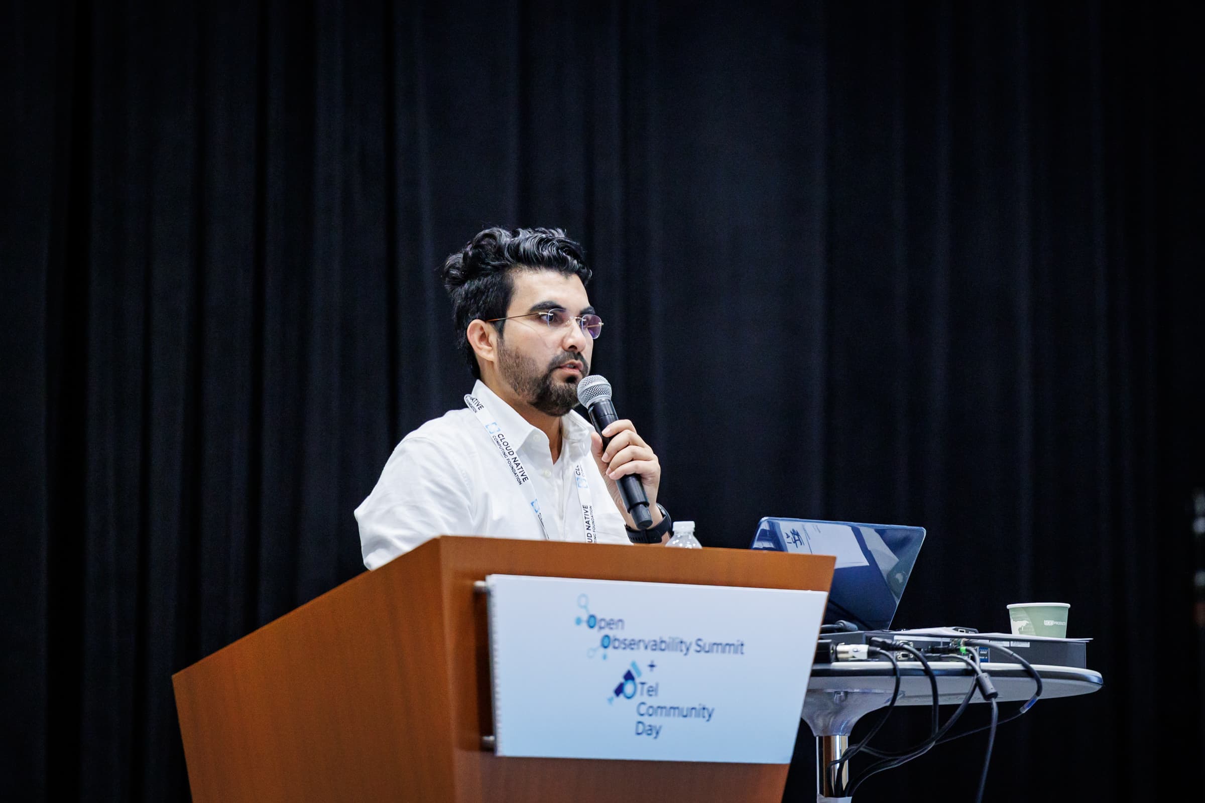 Ravindra Bhargava speaking at the Open Observability Summit and OTel Community Day